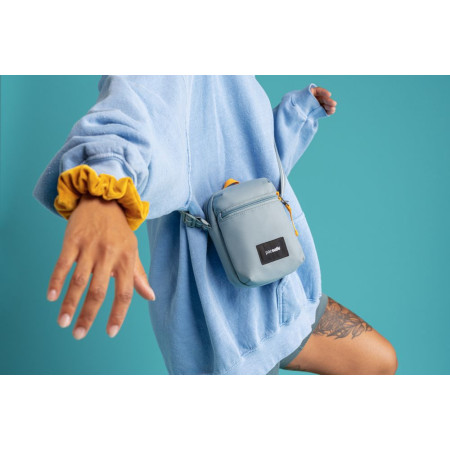 Сумка через плече антизлодій Pacsafe GO Micro Crossbody (свіжий м'ятний/помаранчевий)