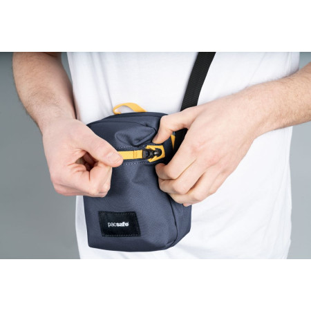 Сумка через плече антизлодій Pacsafe GO Micro Crossbody (темно-синій/жовтий)
